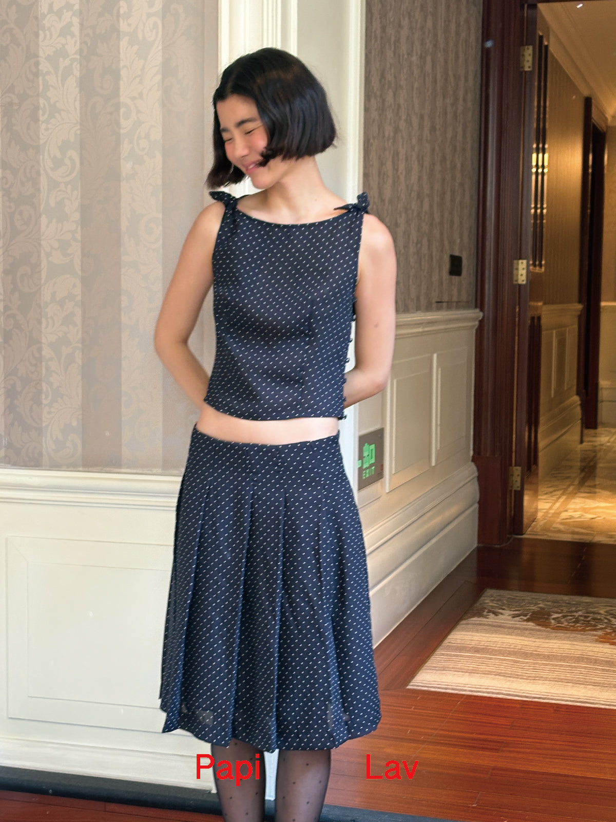 NAVY POLKA DOT ROSY TOP