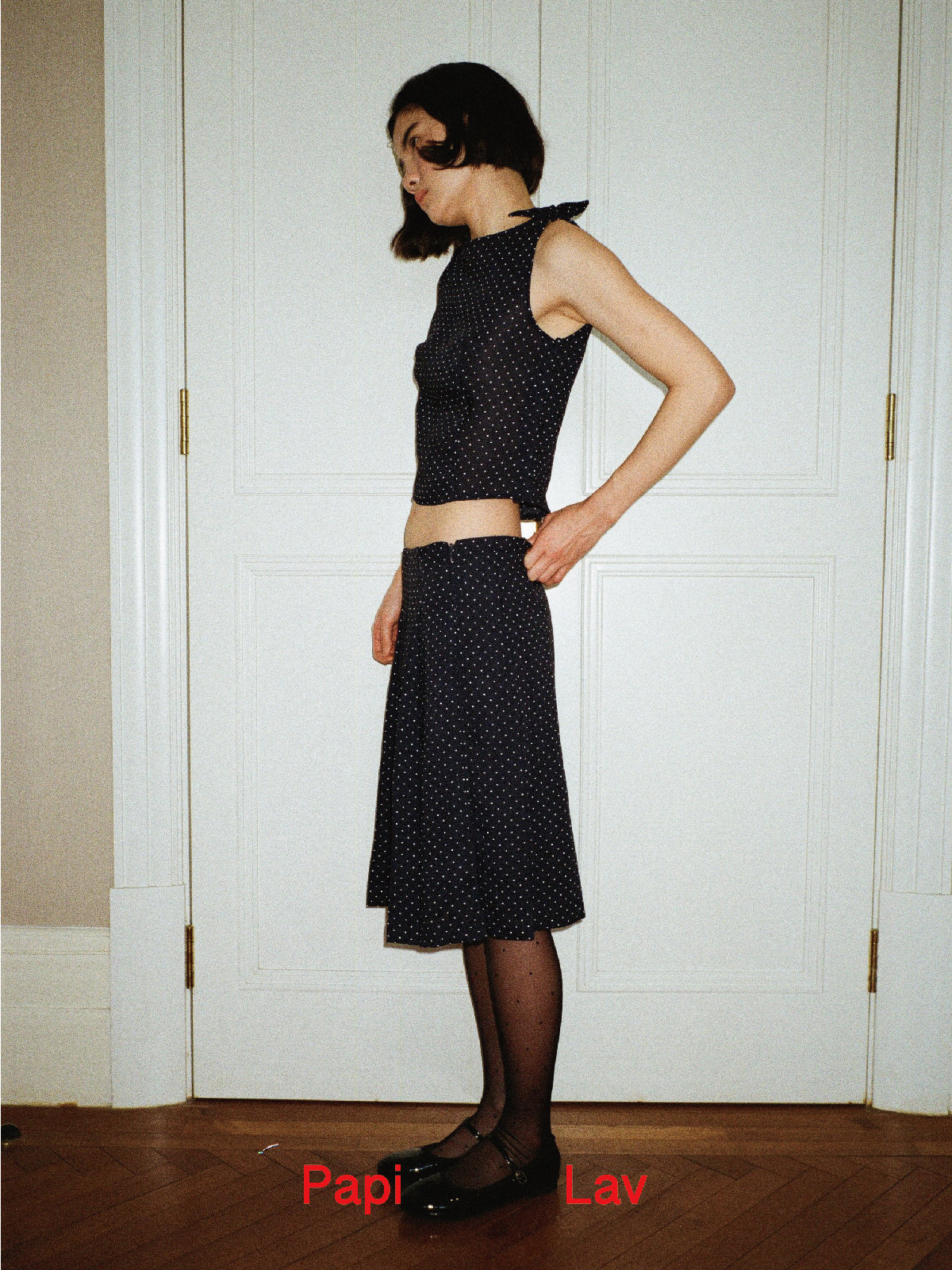 NAVY POLKA DOT NINI PLEATED SKIRT