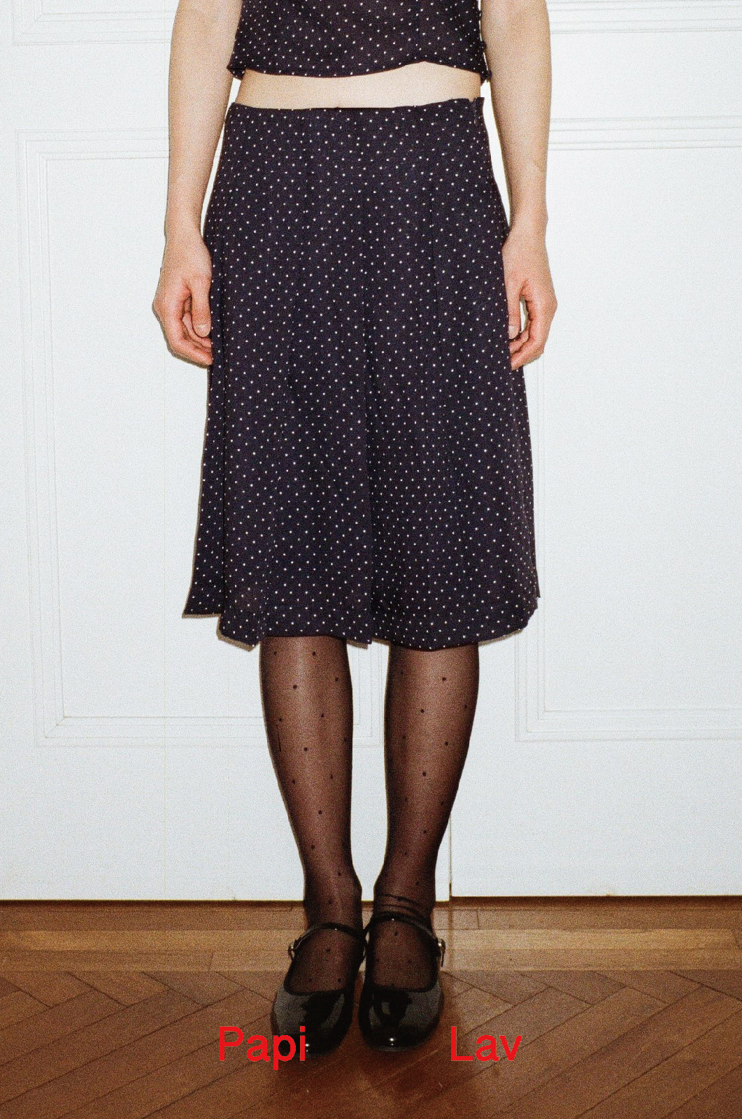 NAVY POLKA DOT NINI PLEATED SKIRT